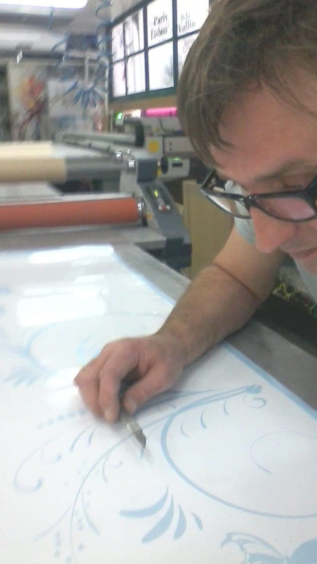 The artist drawing a design by hand